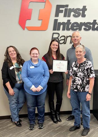 First Interstate Bank staff holding certificate of appreciation for sponsoring Medford Food Project